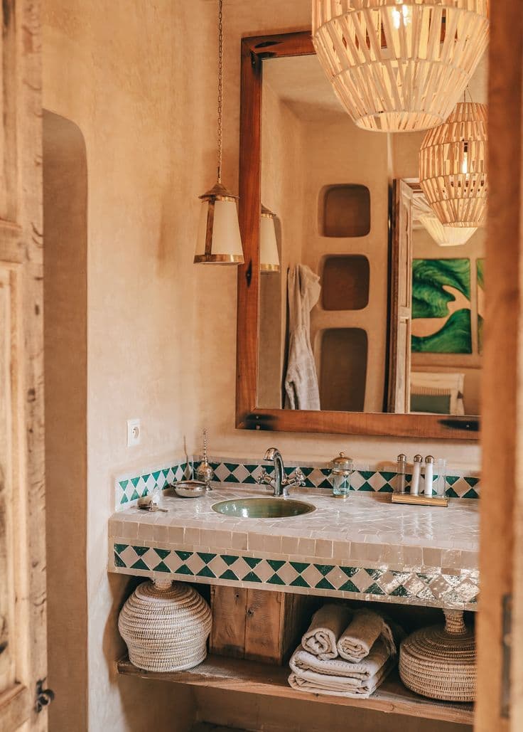 a bathroom with a sink and mirror next to a wooden shelf under a light fixture, classique, bois